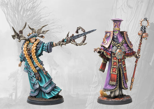 The two painted character miniatures from the Ashes and Faith pack: a Nord Prophetess in teal and an Old Dominion Archimandrite in purple, standing side-by-side.