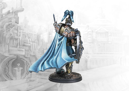 A rear view of the painted City States Lochagos miniature, showcasing the flowing blue cape and the intricate details on the back of the shield and armor.