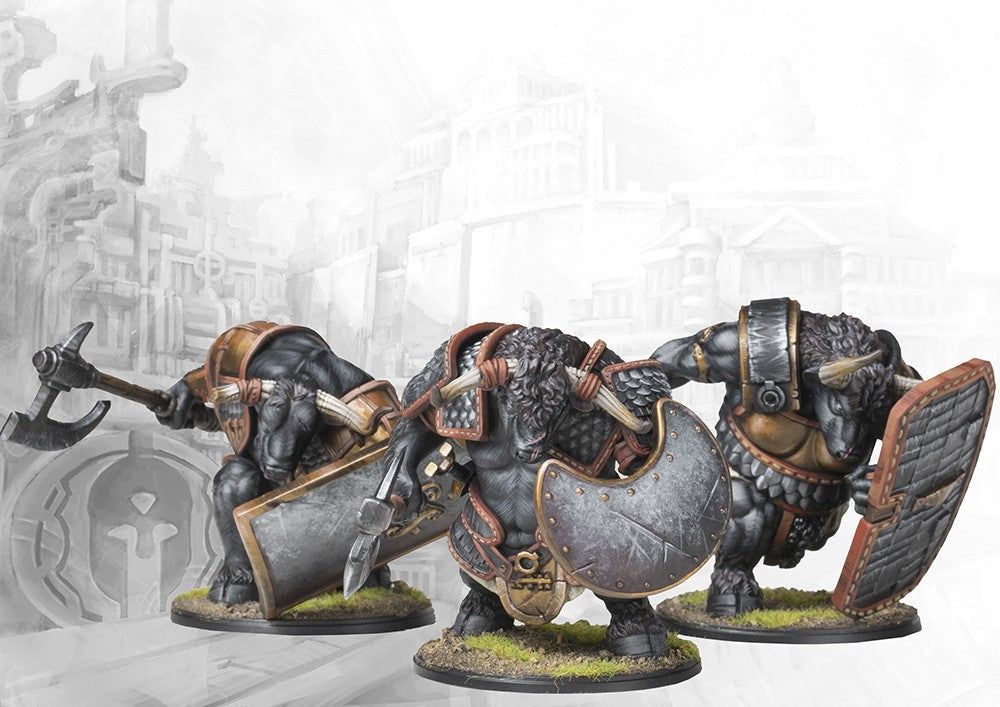 Three individual City States Minotaur Haspist miniatures on round bases, showcasing their powerful builds, large shields, and heavy axes.