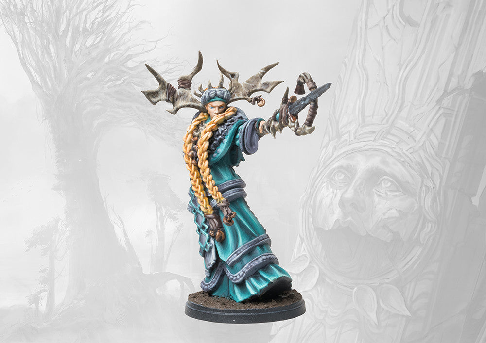 A close-up of the painted Nord Prophetess miniature from Conquest: Ashes and Faith, wearing antlers and teal robes while holding a ceremonial dagger.
