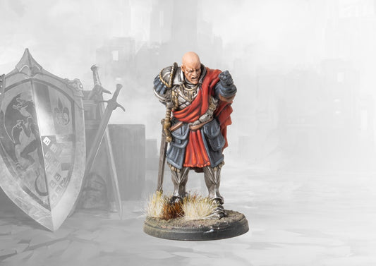 A studio-painted miniature of the Conquest Hundred Kingdoms Drillmaster, a stern, bald officer in plate armor shouting commands.