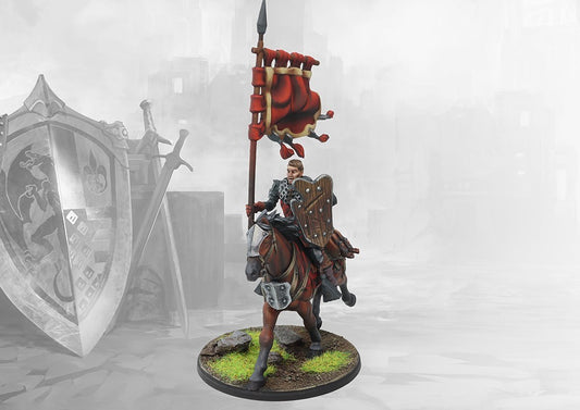 A painted miniature of a Conquest Hundred Kingdoms Mounted Squire standard bearer, holding a large red banner.