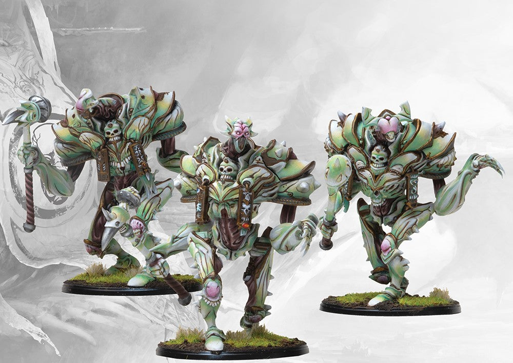 Close-up view of the painted Incarnate Sentinels, highlighting their unique green bone-like armor and grotesque organ-assemblage design.