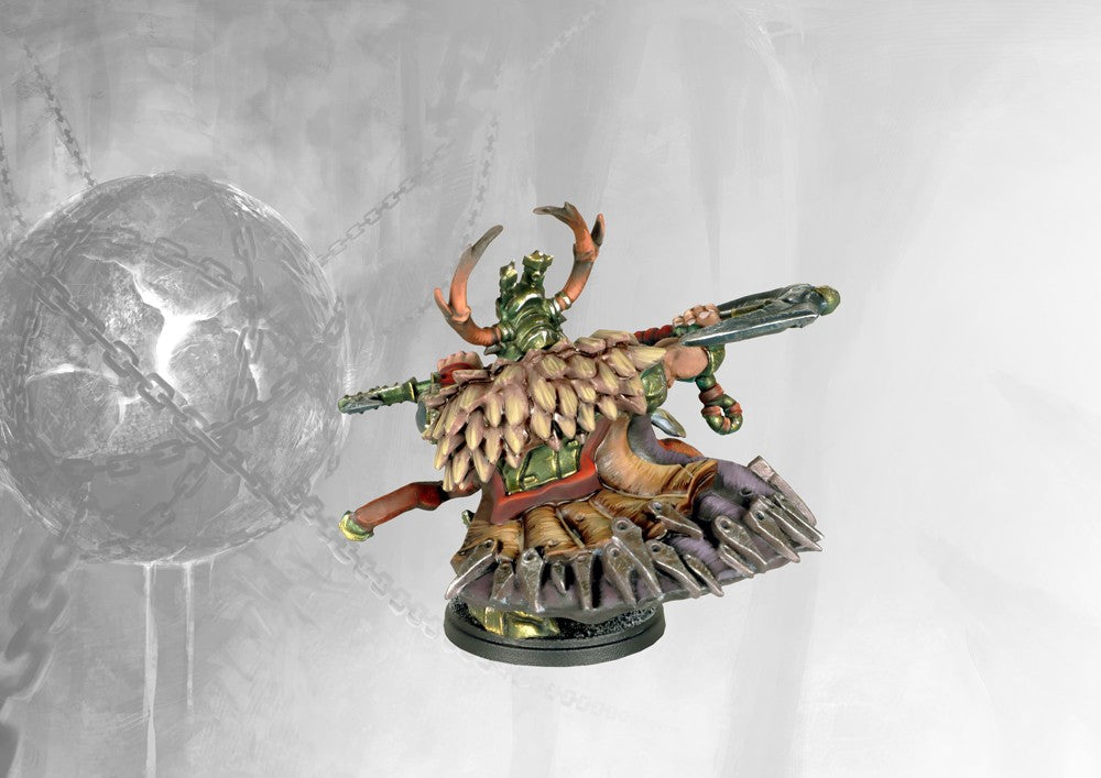 Rear view of the painted Hold Raegh miniature, highlighting the fur/feather cloak, heavy armor plating, and the dynamic pose.