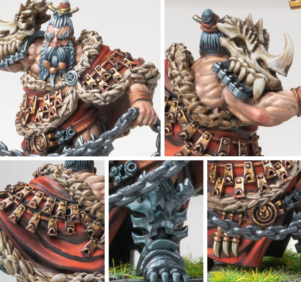 Close-up details of the Raegh Drake Rider miniature, emphasizing the muscular arms, fur cloak, bone shoulder guards, and the heavy chain weapon.
