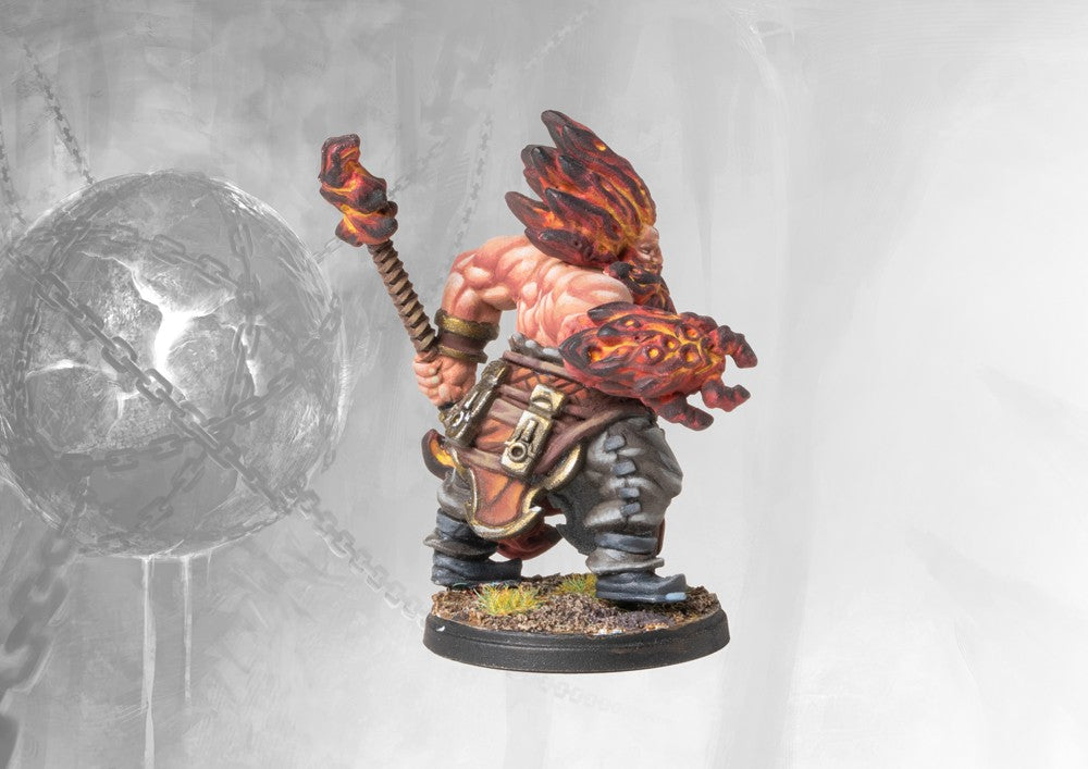Rear view of the painted Dweghom Tempered Sorcerer miniature, showing the massive, glowing elemental fists and fiery hair.