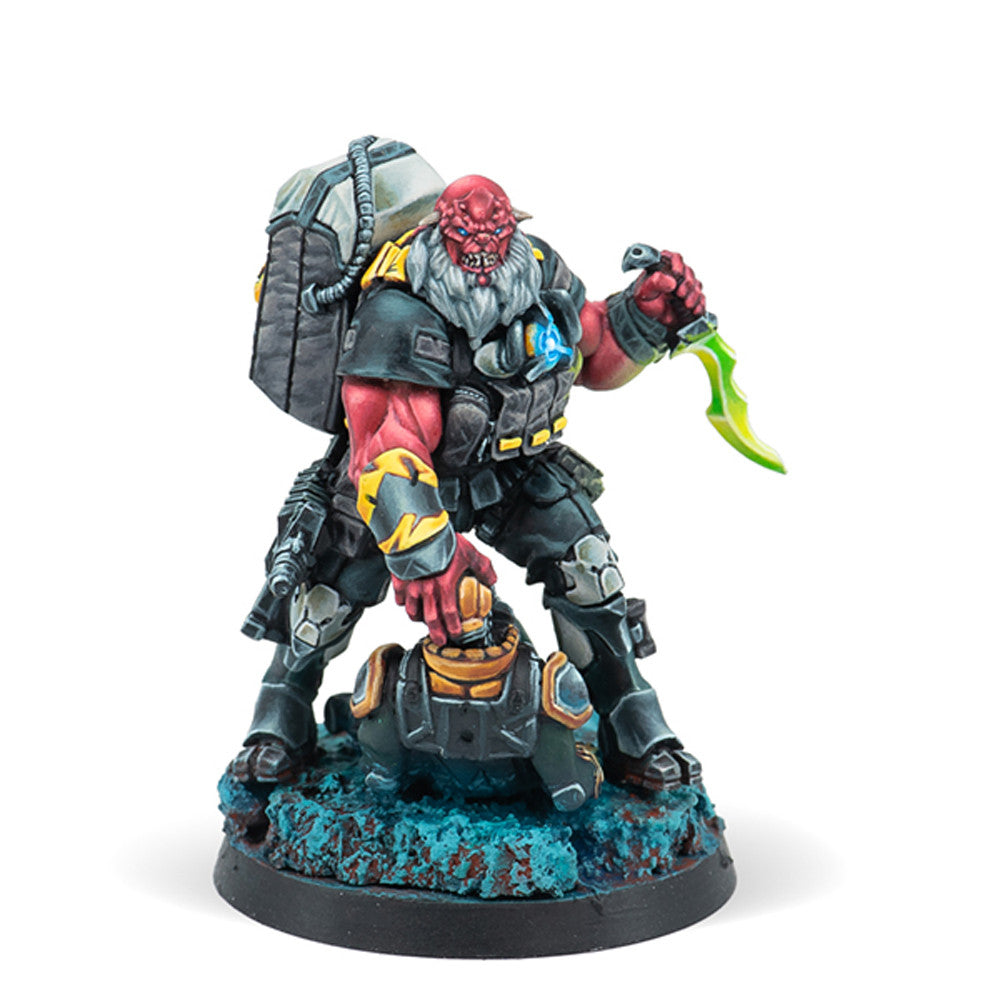 Krakot Renegades miniature, showing a fierce red-skinned Morat fugitive holding two submachine guns.