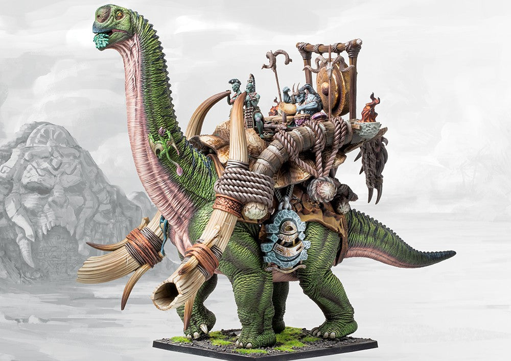 A painted W'adrhŭn Drum Beast miniature with crew, highlighting the detailed tribal structures, war drums, and the huge, placid dinosaur.