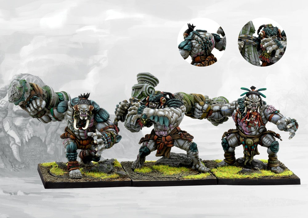 Three painted W'adrhŭn Warbred miniatures in dynamic attacking poses, showcasing the powerful, muscular physique and tribal war gear.