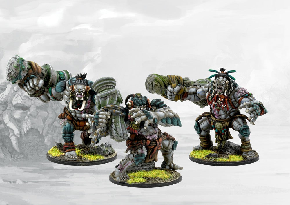 Three painted W'adrhŭn Warbred miniatures in dynamic attacking poses, showcasing the powerful, muscular physique and tribal war gear.