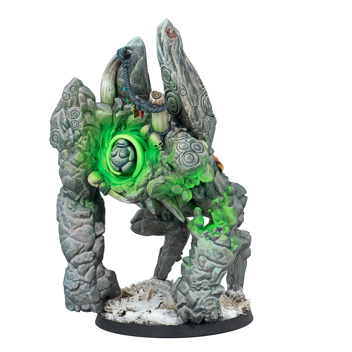 A painted Warcrow miniature of the Northern Tribes Rock Troll, a large stone elemental with a glowing green core.