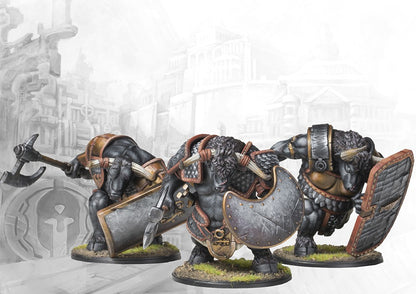 Three individual City States Minotaur Haspist miniatures on round bases, showcasing their powerful builds, large shields, and heavy axes.