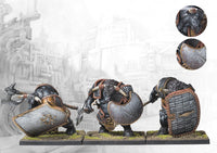 Three fully painted City States Minotaur Haspist miniatures on square bases, depicted as heavily armored minotaurs carrying massive shields and axes.