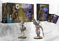 The complete Conquest: Fanning the Fire Lore Campaign Pack, showing the box, book, City States Gorgon and Sorcerer Kings Ghilman character miniatures, and cards.