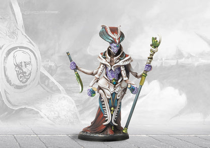 A fully painted Spires Alchemist miniature, featuring four arms, a tall headdress, and holding biomantic vials and a staff.