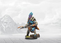 A painted Wadrhun Orc-like warrior miniature, featuring blue skin, bone armor, and a large feathered headdress.