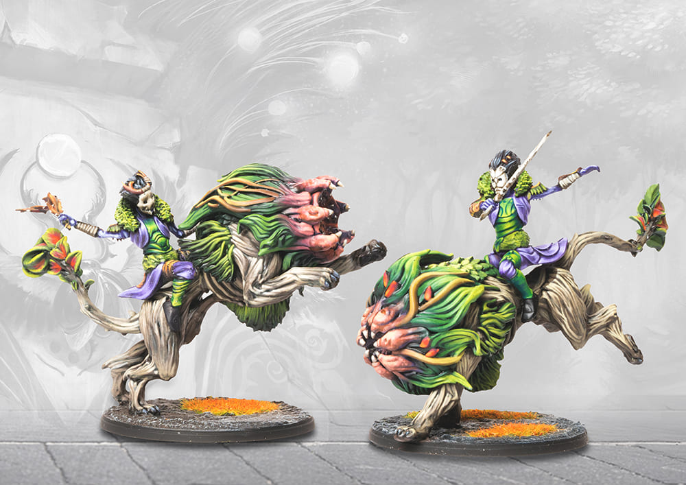 Two painted plastic Fianna Cavalry models showing detailed armor and monstrous mount features.