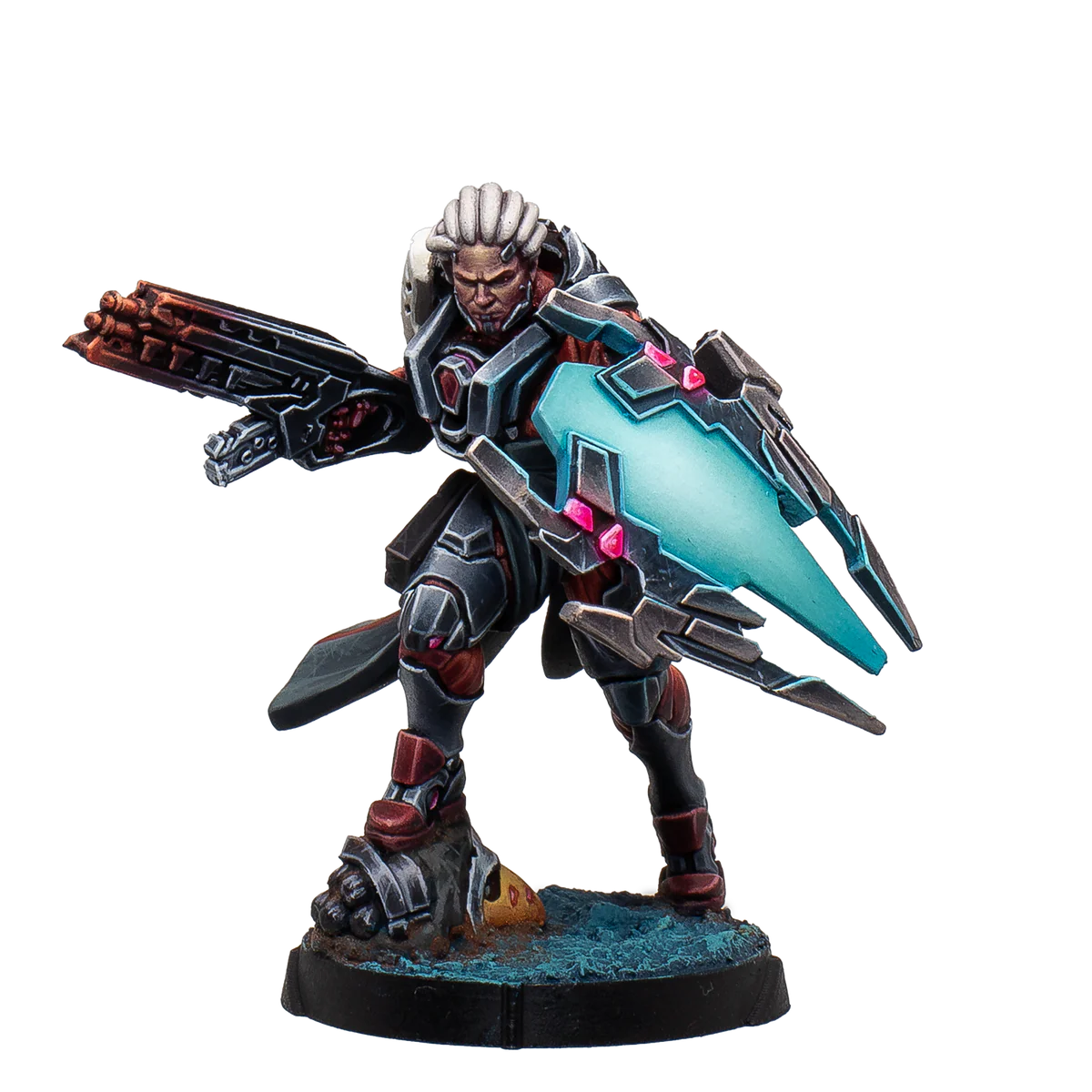 A painted Infinity Combined Army Achilles miniature, a heavily armored cybernetic warrior holding a large gun and an illuminated energy shield.