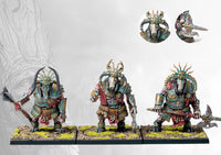 Three fully painted Old Dominion Buccephaloi miniatures on square bases, armed with heavy axes and wearing ornate, weathered bronze and teal armor.