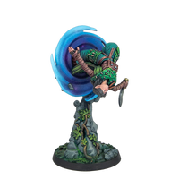 A fully painted Warcrow Aileen Cethir Wynn miniature, depicting the Sÿenann character emerging from a magical blue portal in a dynamic pose.