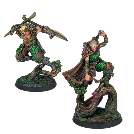 Two painted Warcrow Sÿenann Supports miniatures, featuring dynamic elven warriors leaping from tree branches, armed with blades and bows.