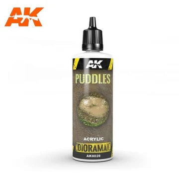 A bottle of AK Interactive Diorama Series AK8028 Terrains Puddles, an acrylic product for creating realistic water puddles on models and dioramas.