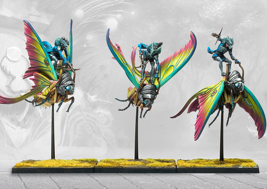 Three expertly painted Ciannir Riders miniatures from the Conquest tabletop game, mounted on large moths with vibrant, colourful wings.