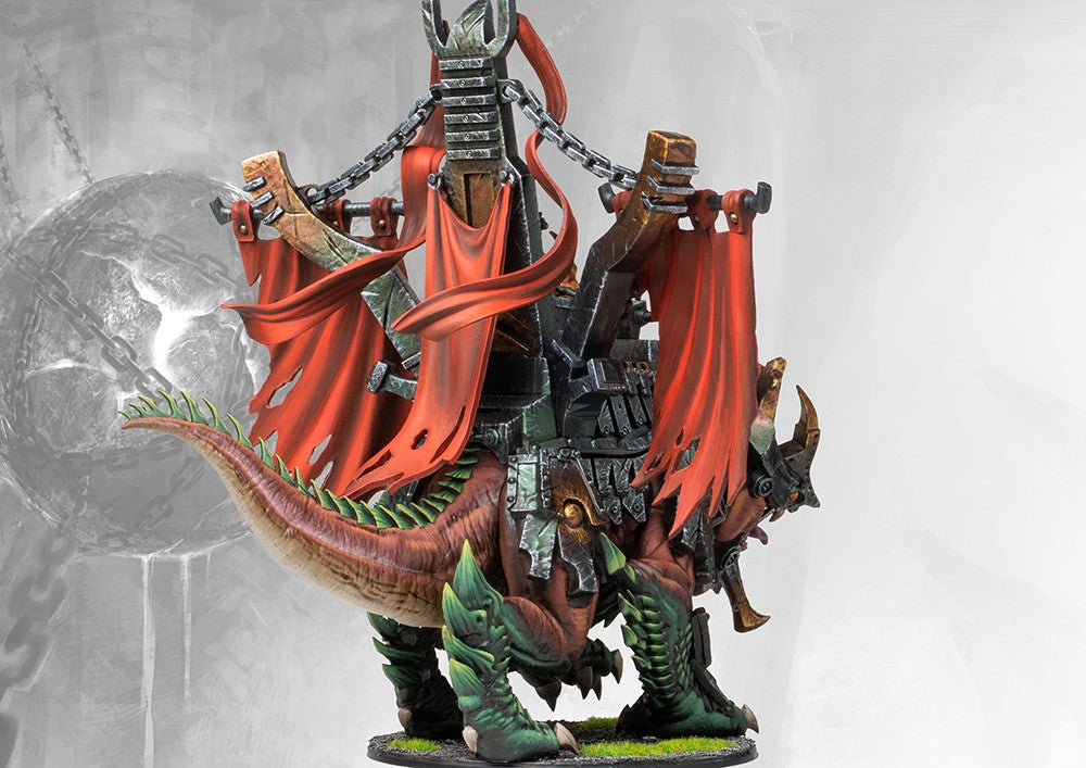 Rear view of the painted Ironclad Drake monster, highlighting the damaged war banners, heavy plate armor, and fierce serpentine tail.