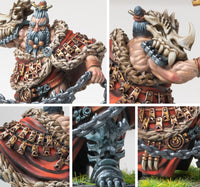 Close-up details of the Raegh Drake Rider miniature, emphasizing the muscular arms, fur cloak, bone shoulder guards, and the heavy chain weapon.