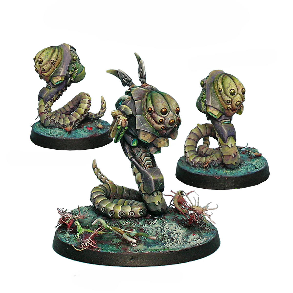 Three painted metal miniatures for the Combined Army including one Med-Tech Obsidon Medchanoid and two Slave Drones.