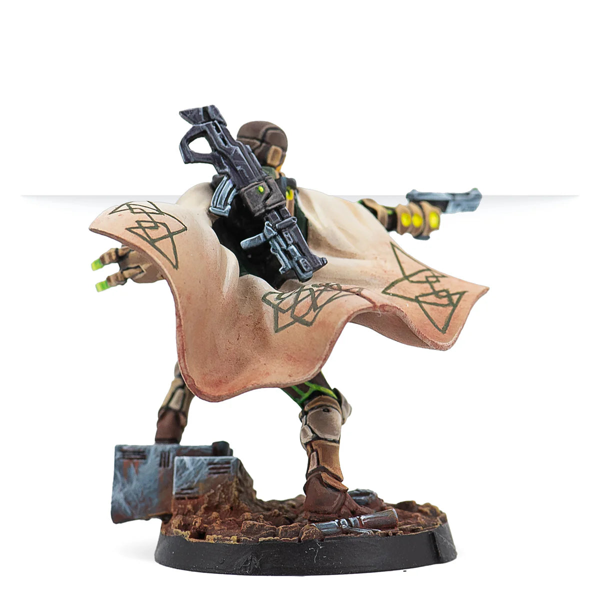 A rear view of the painted Hussein Al-Djabel miniature, with his rifle slung across his back and cape flowing.