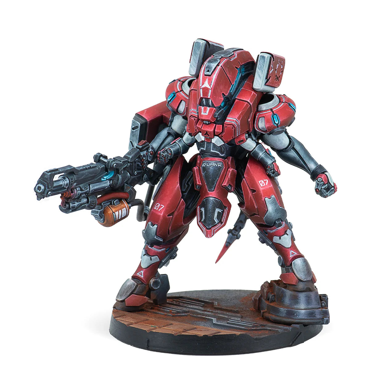 A painted Infinity miniature of the Nomad Iguana TAG, a red and white mech armed with a large machine gun.