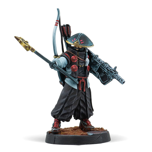 A painted Infinity miniature of a Yamabushi, a warrior monk in black robes with a Chain Rifle and Panzerfaust.