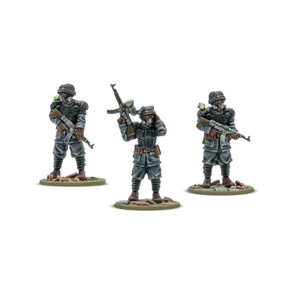 Three painted Warlord Resin miniatures of a Totenrotte Platoon Commander and his bodyguards in Shocktrooper advanced body armor.