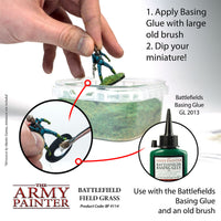 Instructional image on applying Basing Glue to miniatures with The Army Painter branding.