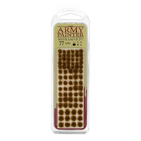 A blister pack of The Army Painter Highland Tuft, showing 77 individual grass tufts with a dry, brownish highland colour.