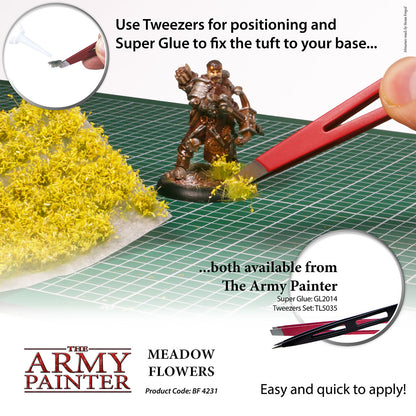 Advertisement for The Army Painter's Meadow Flowers product with tweezers and super glue on a grid surface.
