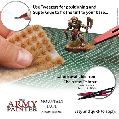 Advertisement for The Army Painter mountain tuft with tools and text on a grid background