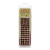 A blister pack of The Army Painter Scorched Tuft, showing 77 individual grass tufts with a dark, burnt, and scorched appearance.