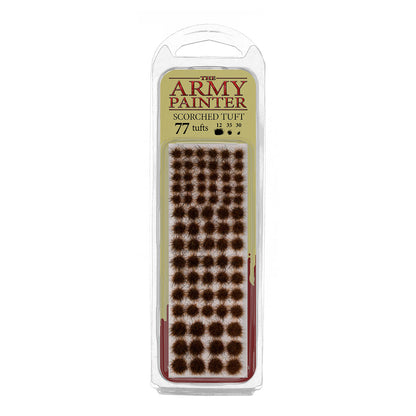 A blister pack of The Army Painter Scorched Tuft, showing 77 individual grass tufts with a dark, burnt, and scorched appearance.