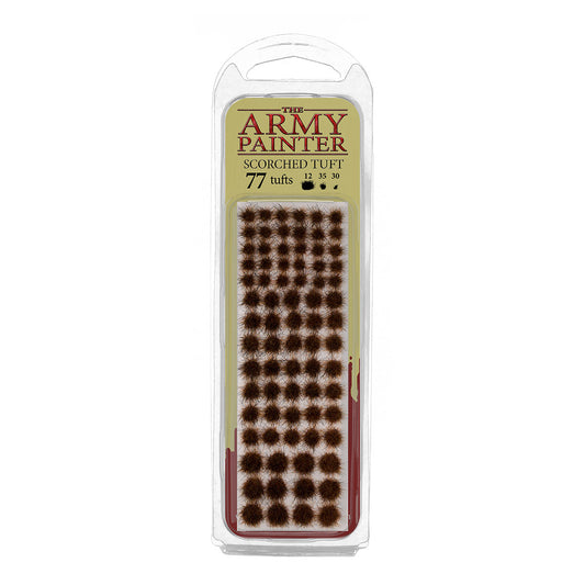 A blister pack of The Army Painter Scorched Tuft, showing 77 individual grass tufts with a dark, burnt, and scorched appearance.