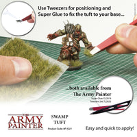 Advertisement for The Army Painter Swamp Tuft with tools and text on a white background