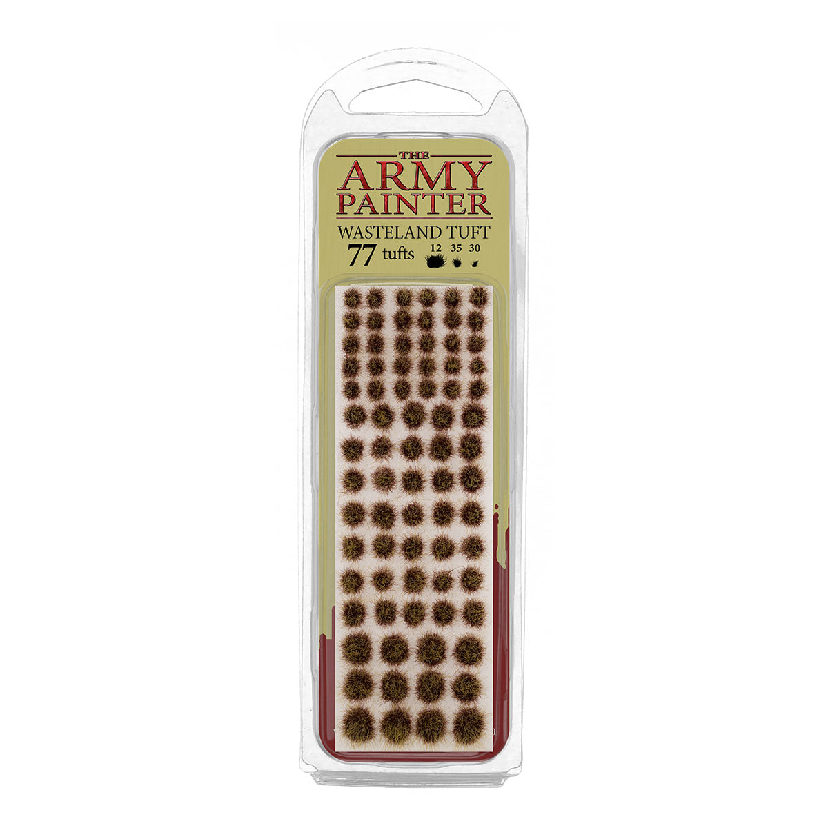 A blister pack of The Army Painter Wasteland Tuft, showing 77 individual grass tufts with a dry, scrubby wasteland colour.