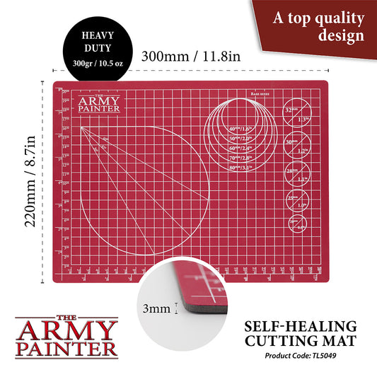Red cutting mat with grid lines and measurements, branded 'The Army Painter', on a white background.