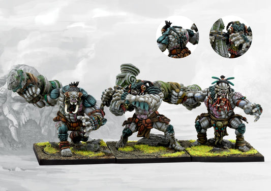 Three painted W'adrhŭn Warbred miniatures in dynamic attacking poses, showcasing the powerful, muscular physique and tribal war gear.