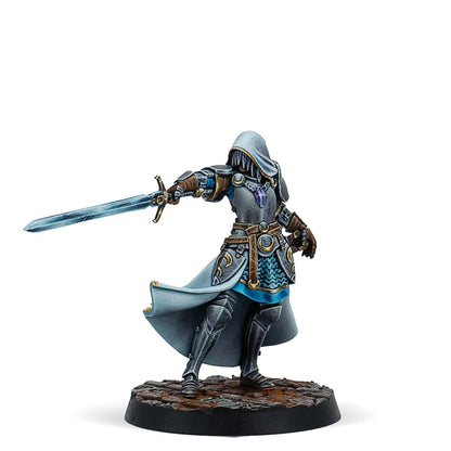 A painted Warcrow miniature of Morgane of Jauffret, a Feudom Syzigian in a hooded cloak, holding a glowing sword.