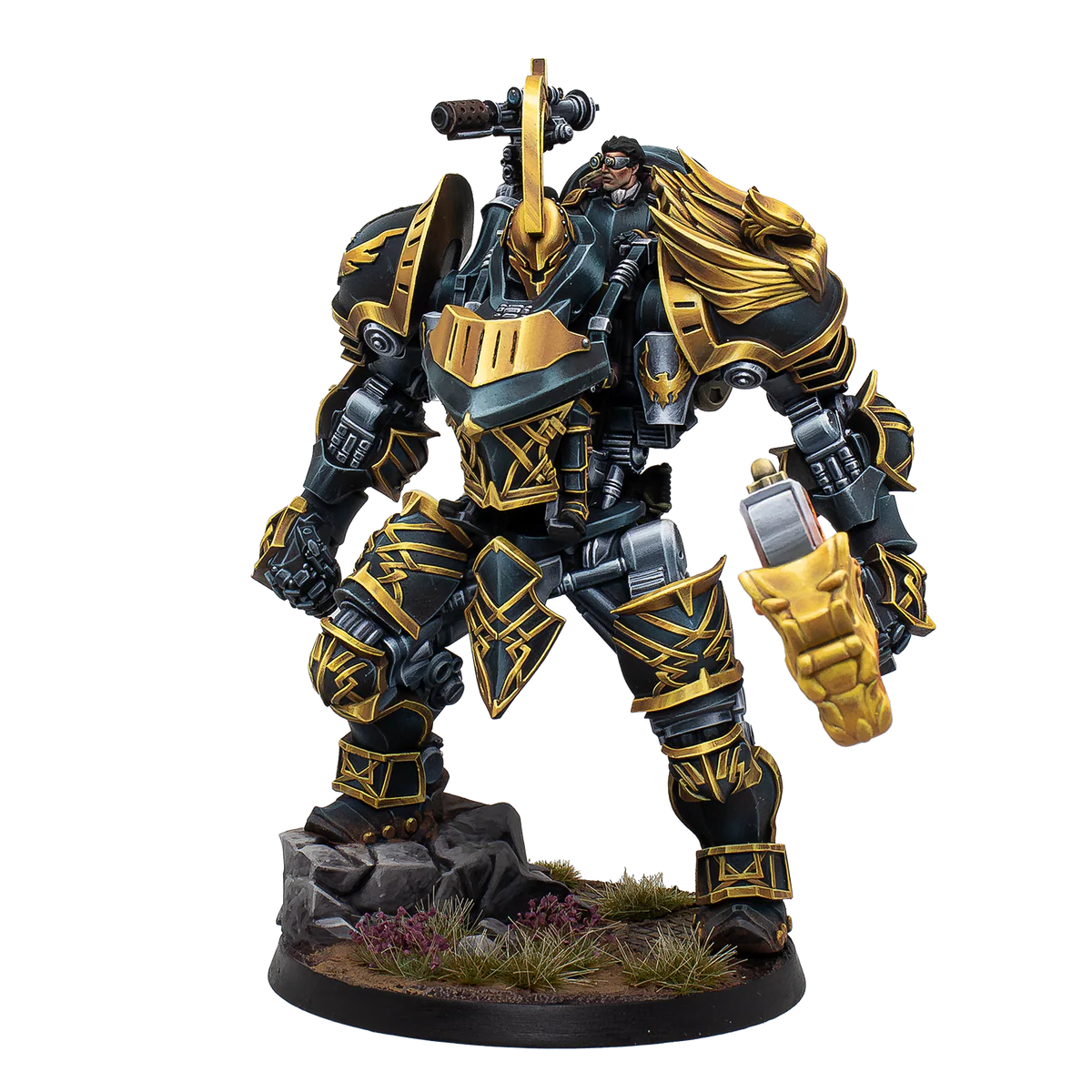 A painted Warcrow miniature of the Hegemony of Embersig War Rig, a large mech in black and gold armour.